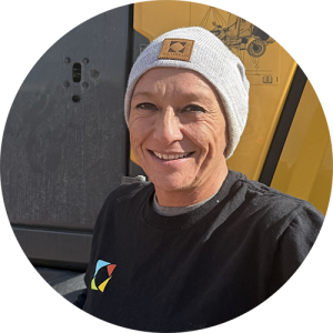 A woman outside, smiling.